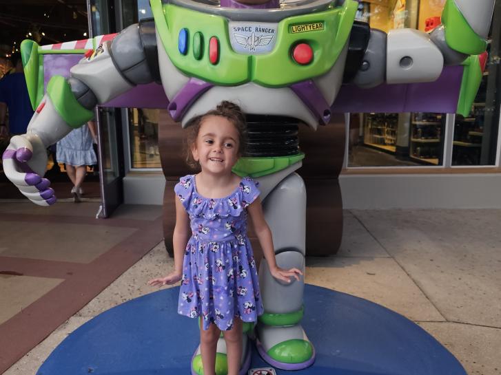 Guest Photo from Kenny Evans: Guest with Buzz Lightyear statue at Walt Disney World